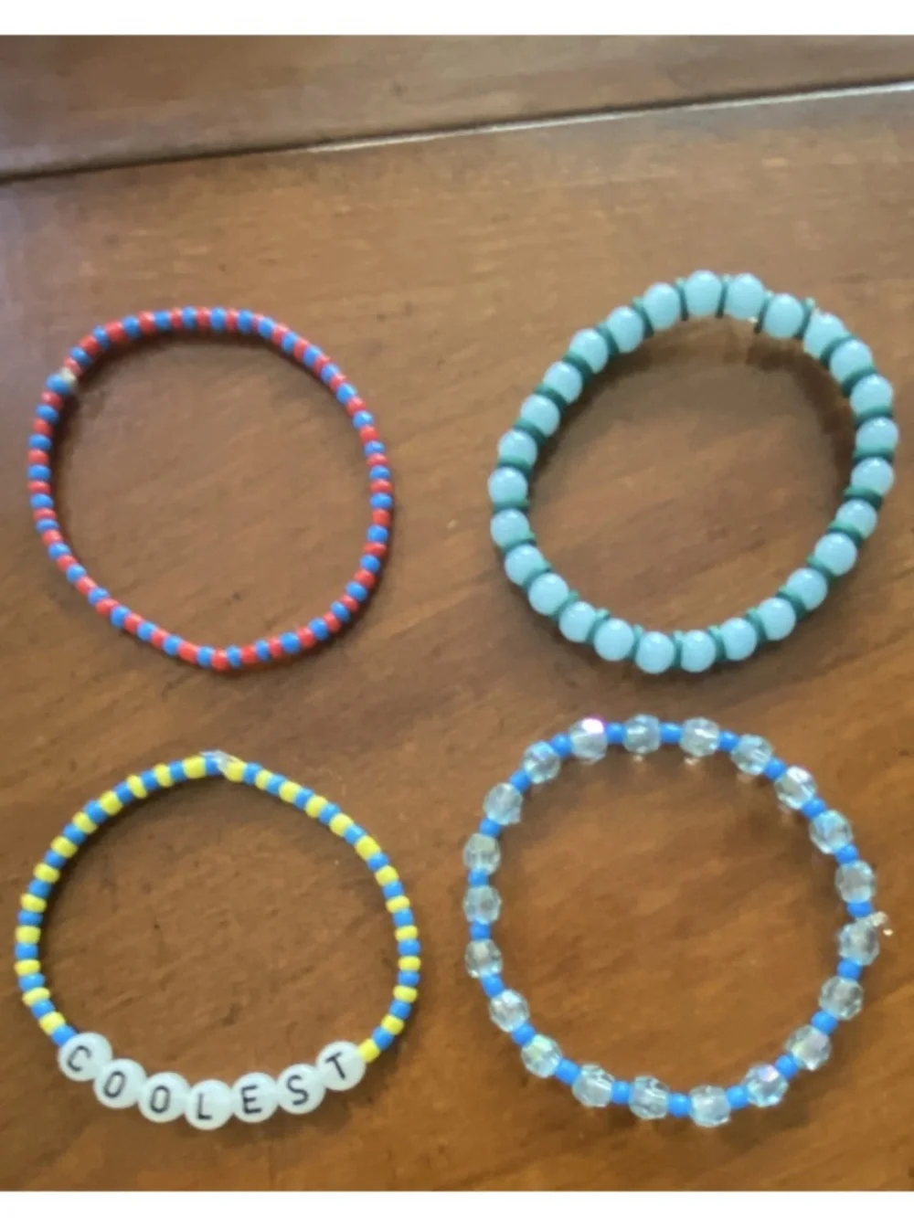 Lot of 4 Stackable Beaded Stretch Bracelets Plastic Round, COOLEST Letter